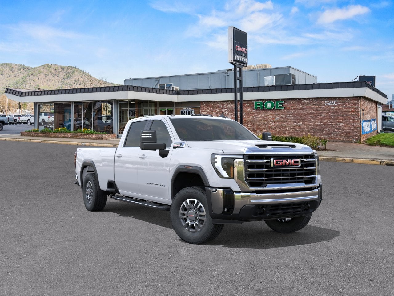 2026 GMC Sierra 3500 HD SLE in Summit White — front three-quarter view